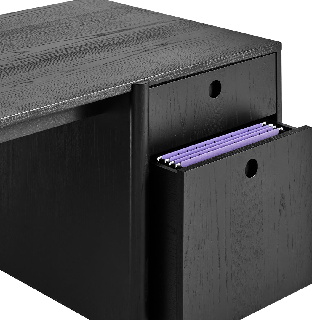Black filing cabinet with a sleek wood grain pattern and vibrant purple hanging files peeking out of a side drawer.