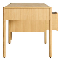 Light wood desk with a smooth, natural finish and minimalistic design, featuring a single side drawer.