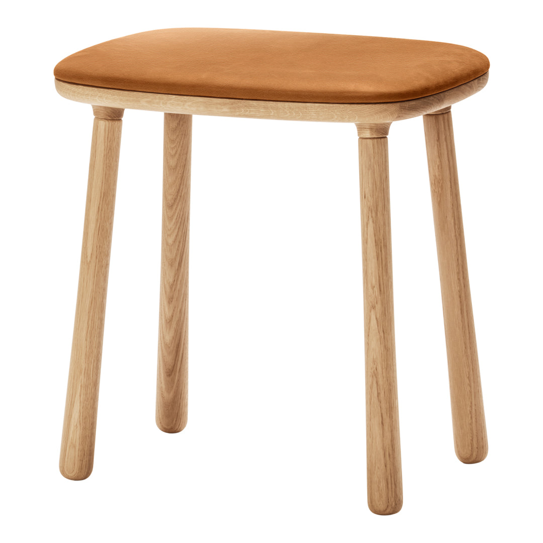Brown leather upholstered stool with natural wood legs, showcasing a minimalist design and smooth surface.