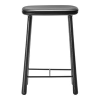 Black bar stool with a sleek, minimalist design and smooth surface, featuring four sturdy legs and a subtle sheen.