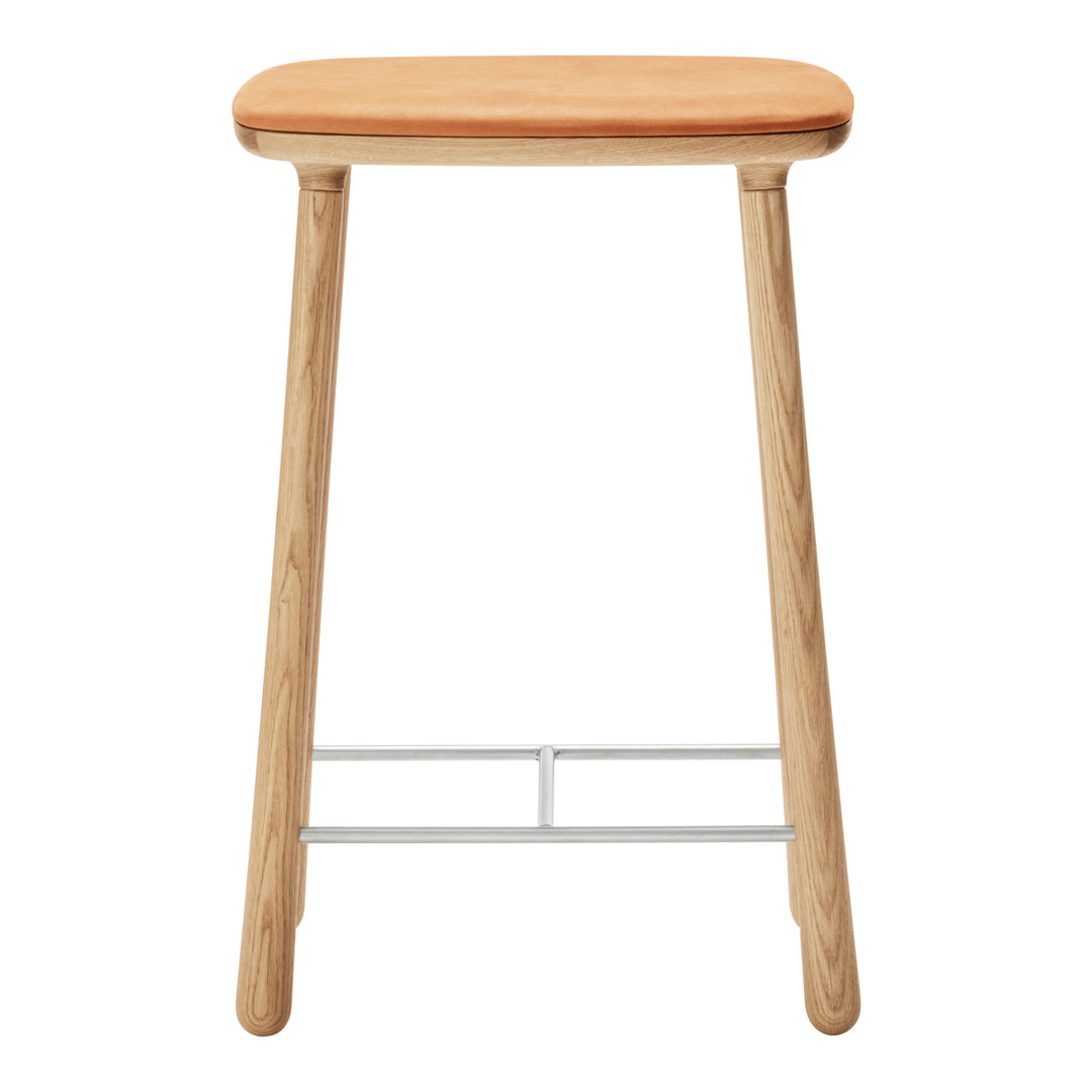 Natural wood stool with a light oak finish and a smooth, warm orange seat. Minimalist design with a simple, clean look.