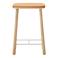 Natural wood stool with a light oak finish and a smooth, warm orange seat. Minimalist design with a simple, clean look.