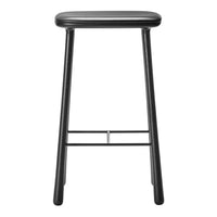 Black metal bar stool with a sleek, minimalist design and simple, clean lines. Perfect for modern interiors.