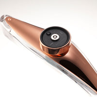 "Stylish amber and copper patterns on a sleek transparent device, showcasing modern elegance."