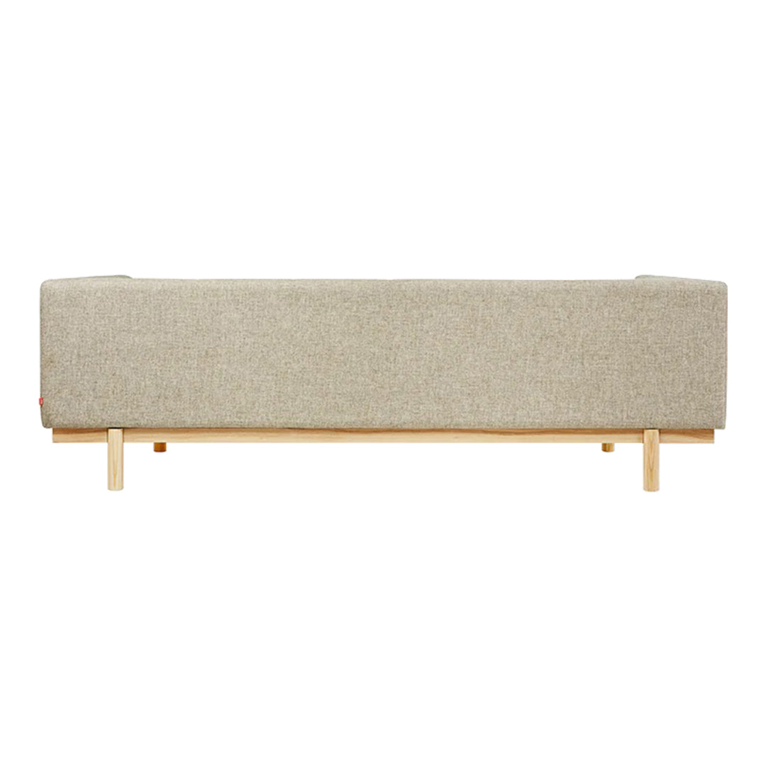 Beige textured upholstery on a minimalist sofa, featuring a natural wood base for a modern aesthetic.