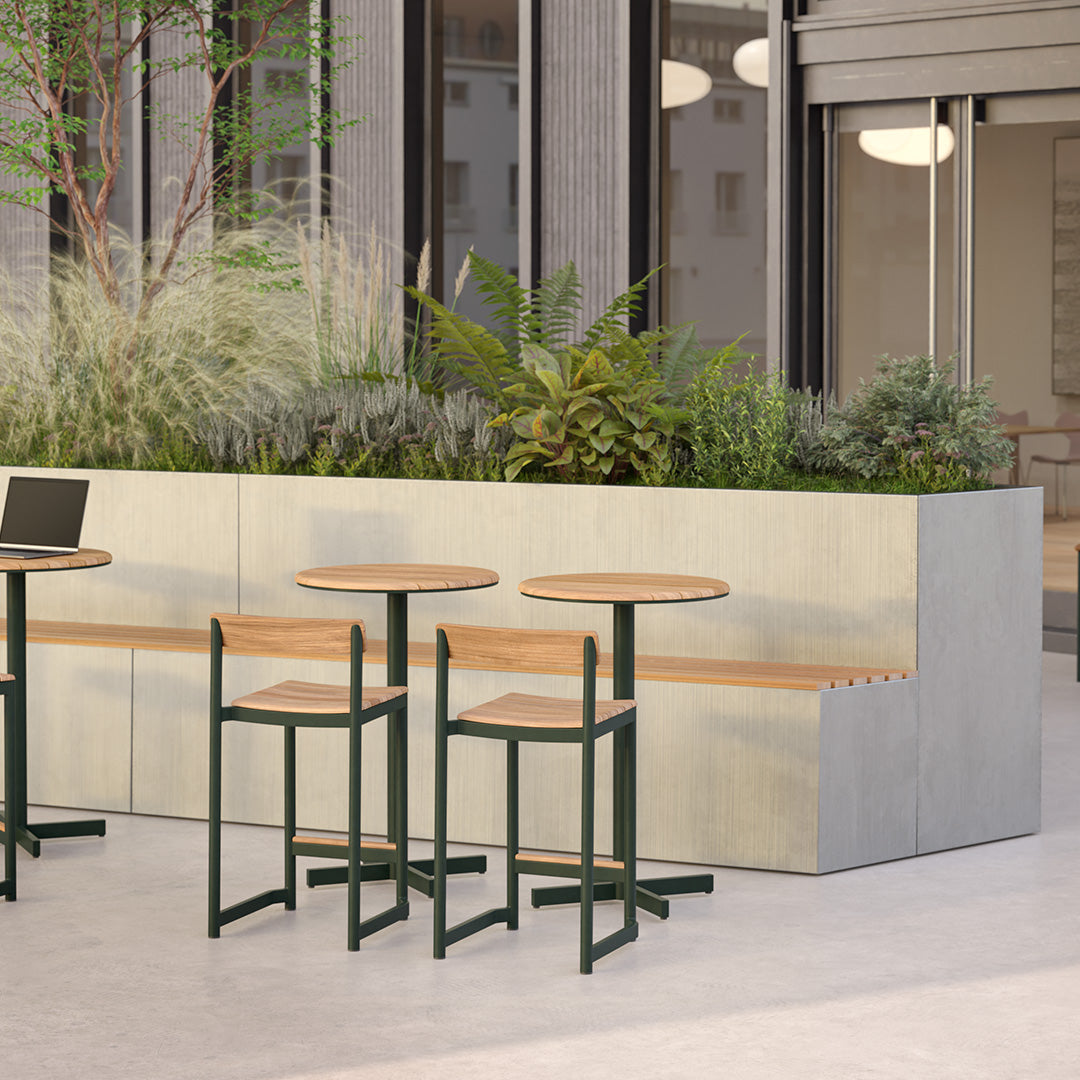 "Modern outdoor furniture set featuring green accents and natural wood tones against a sleek concrete backdrop."