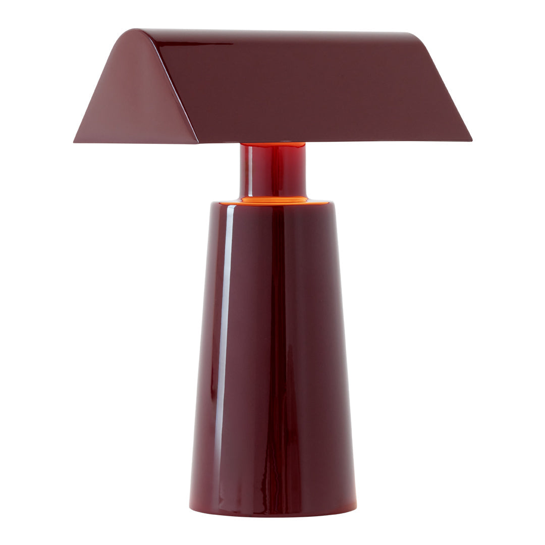 Burgundy modern table lamp with a sleek, geometric design and glossy finish. Perfect for contemporary decor.