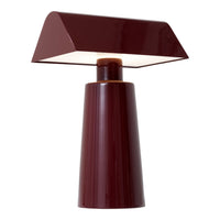 Burgundy table lamp with a geometric base and sleek angular shade, offering a modern, stylish accent.