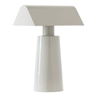 Sleek white table lamp with a minimalist design and smooth, glossy finish. Perfect for modern decor.