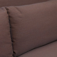 Brown textured cushion with a subtle, woven pattern, adding warmth and comfort to any space.