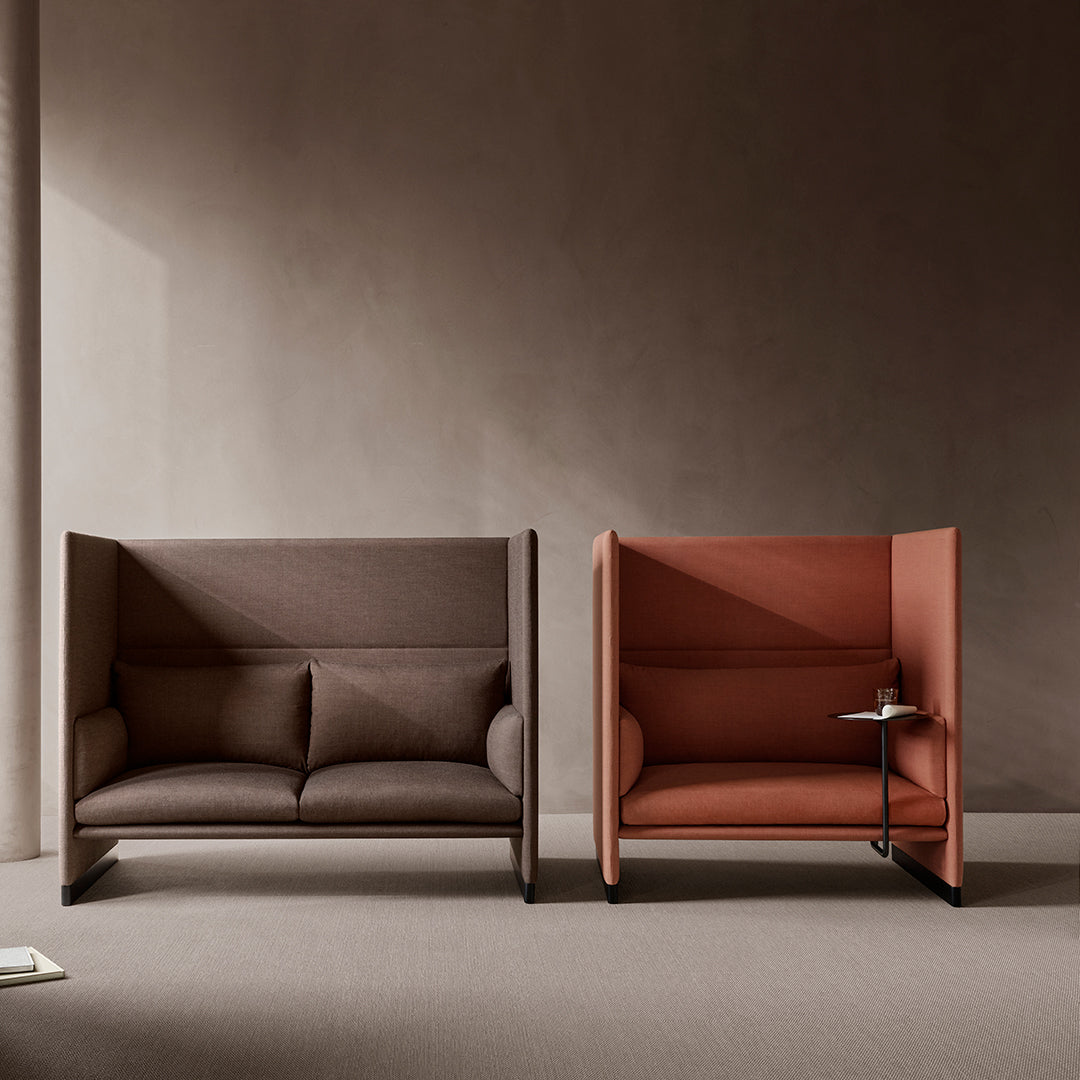 Two modern sofas in rich brown and warm terracotta hues, featuring sleek, minimalist designs with soft textures.
