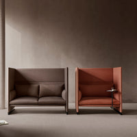 Two modern sofas in rich brown and warm terracotta hues, featuring sleek, minimalist designs with soft textures.