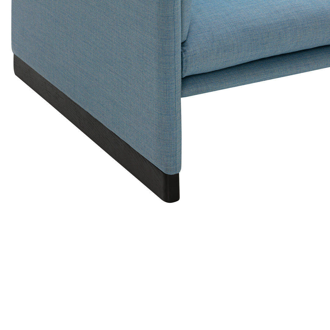 Light blue upholstery with a textured pattern, featuring a contrasting black base for a modern look.