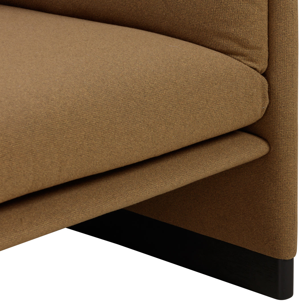 Warm brown upholstery with a smooth texture and sleek black base, showcasing a contemporary design.