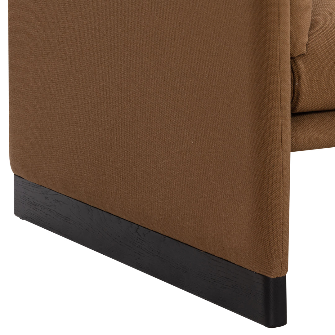 Brown fabric corner with a sleek black base, offering a modern and stylish look. Perfect for contemporary decor.