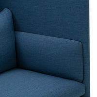 Textured blue fabric in a modern couch design, featuring a smooth, solid color pattern.