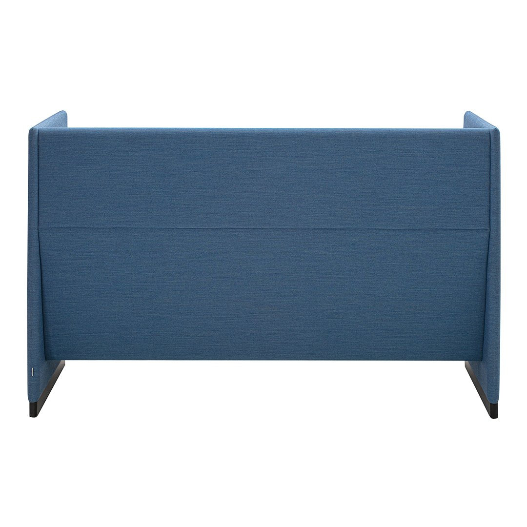 "Solid blue fabric upholstery with a smooth texture and minimalistic design, showcasing a modern style."