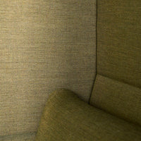 Textured olive green fabric with a subtle weave pattern, ideal for modern upholstery and interior decor.