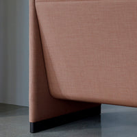 Dusty pink fabric texture with a smooth, modern geometric design and sleek black base. Perfect for contemporary decor.