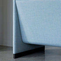 Light blue textured fabric with a sleek black base, showcasing modern design and minimalist aesthetic.