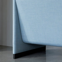 Light blue textured fabric with a sleek black base, showcasing modern design and minimalistic patterns.