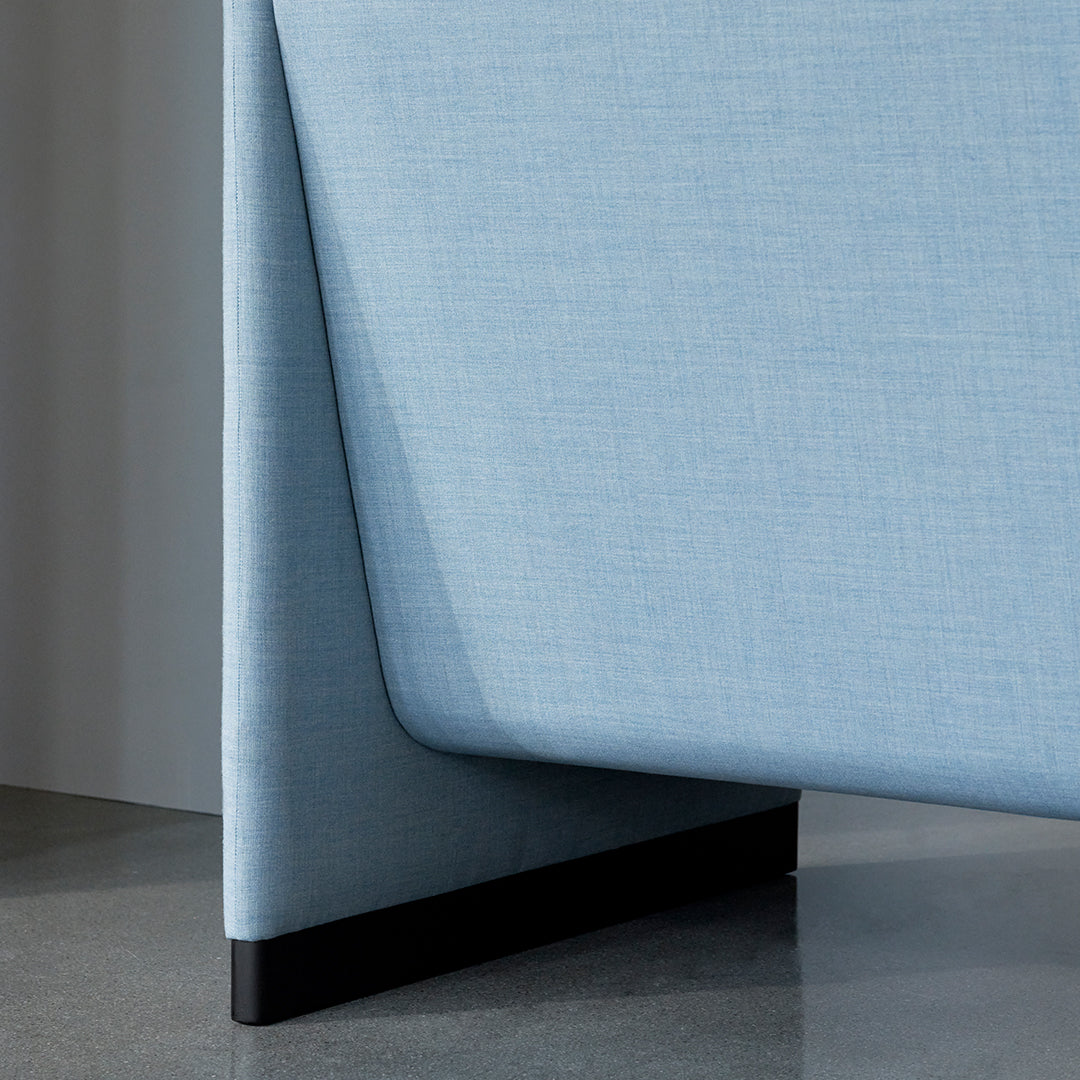 Light blue textured fabric with a sleek, modern edge and contrasting black base. Perfect for contemporary decor.