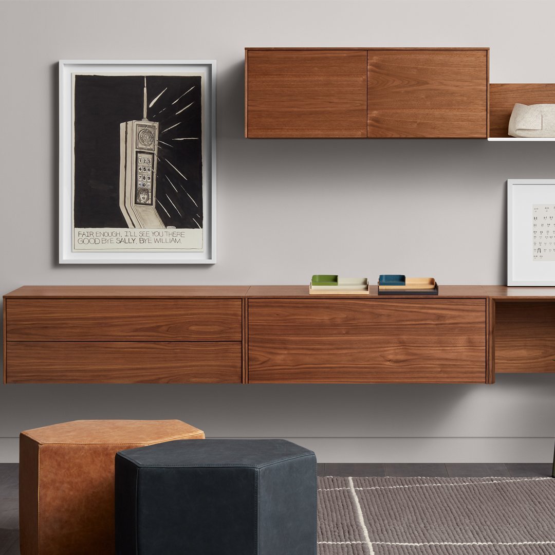 Wooden wall-mounted storage in rich walnut finish, featuring geometric patterns and a sleek, modern design.