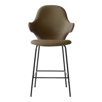 Olive green upholstered stool with a sleek black metal base and modern design, perfect for contemporary spaces.