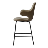 Beige upholstered bar stool with a sleek black metal frame, featuring smooth, modern curves.