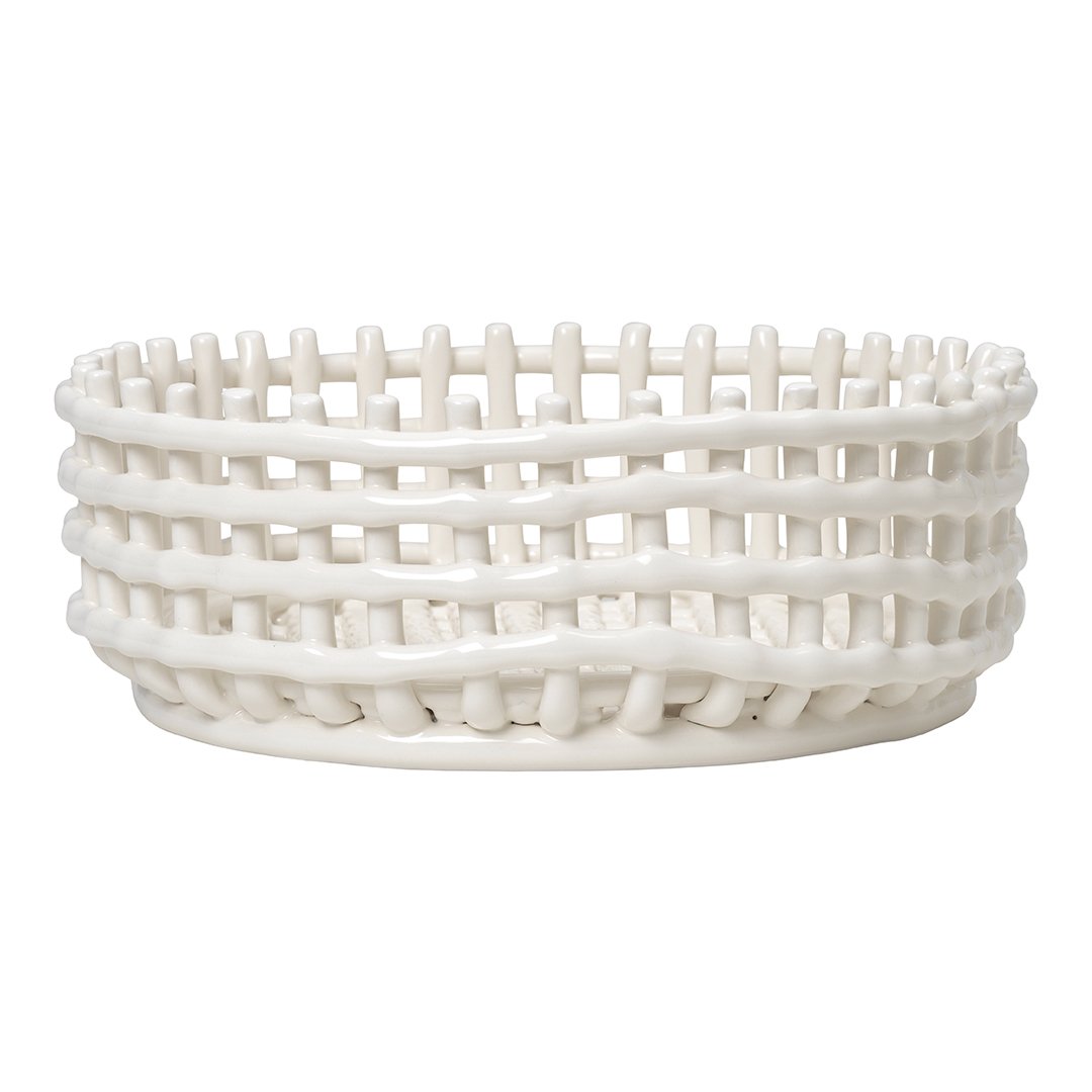 White woven basket with textured, layered patterns and a smooth finish, perfect for stylish storage.