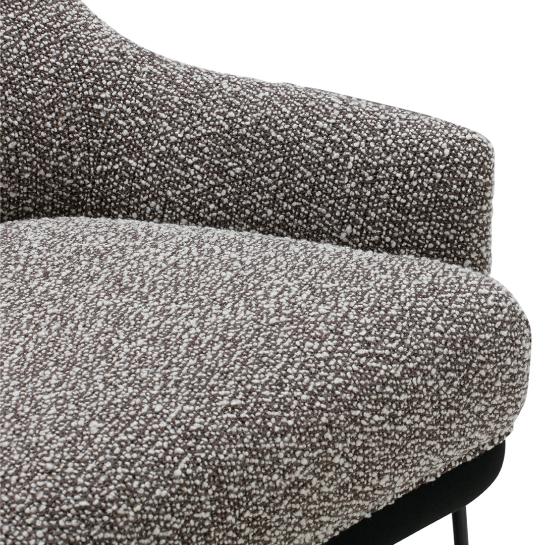 Textured gray fabric with a speckled pattern, featuring shades of brown and white. Perfect for modern decor.