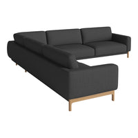 Dark gray sectional sofa with clean lines and wooden legs, featuring a minimalist design and soft fabric texture.