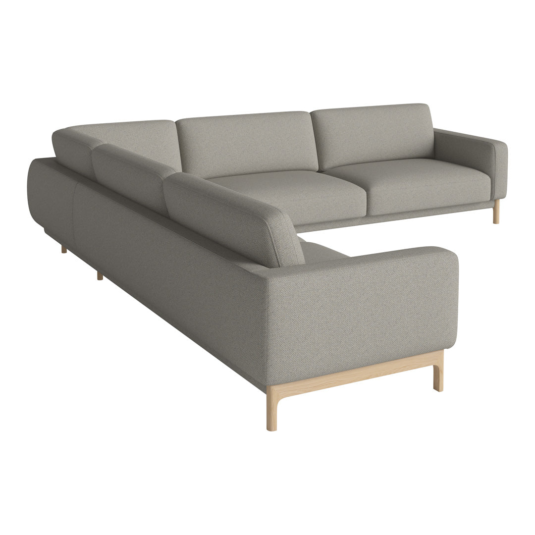Light gray sectional sofa with minimalist design and wooden legs, ideal for contemporary living spaces.
