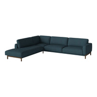 Teal sectional sofa with sleek lines and minimalist design, featuring a solid color upholstery and wooden legs.