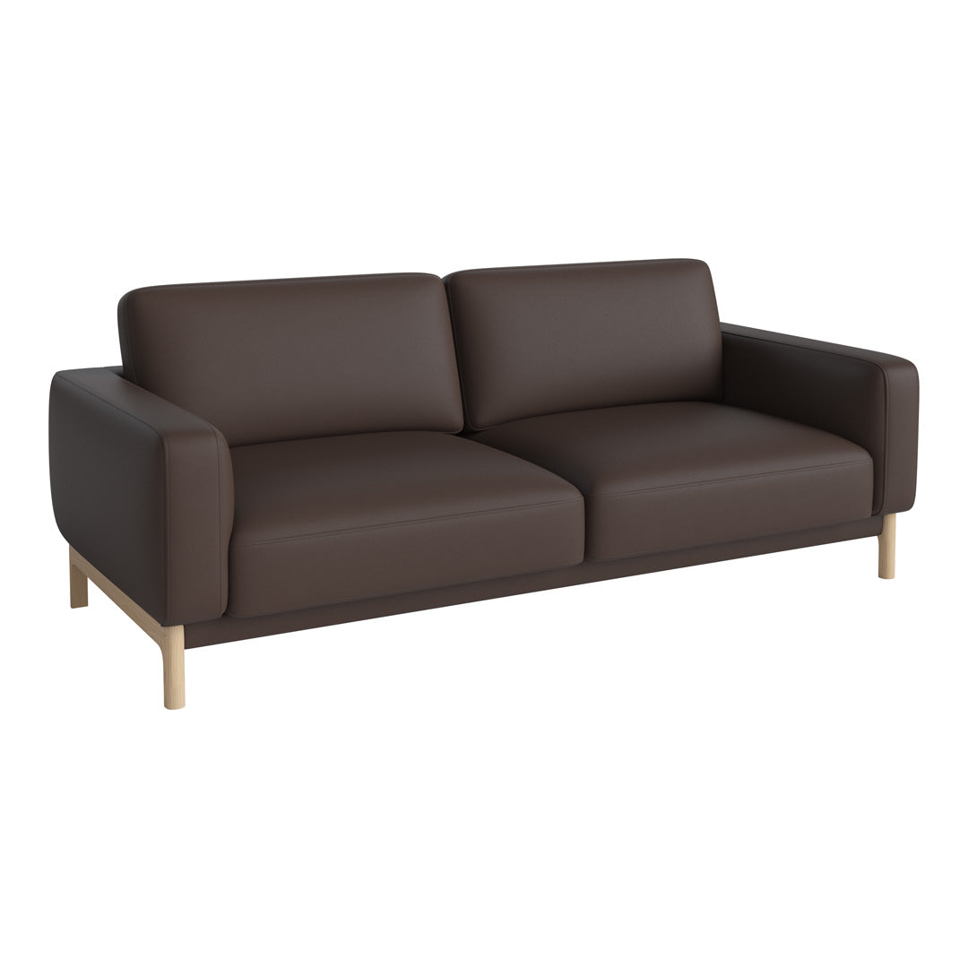Brown leather sofa with a minimalist design and light wooden legs, enhancing modern decor.