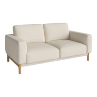 Cream-colored sofa with a minimalist design and natural wood legs. Modern, clean lines and soft upholstery.