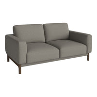 Gray upholstered modern sofa with clean lines and a minimalist design, featuring solid wood legs for added contrast.