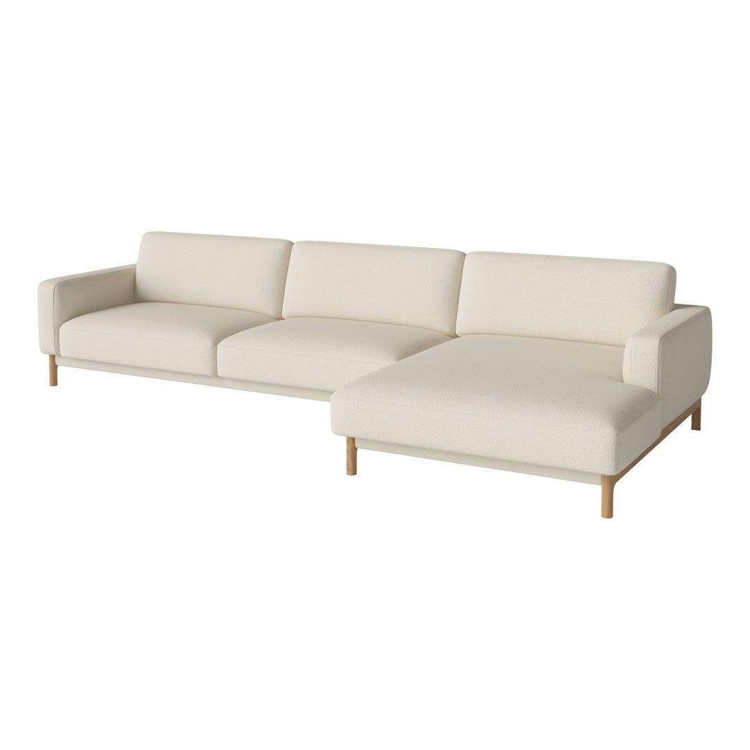 Cream-colored modern sectional sofa with clean lines and solid wood legs. Perfect for contemporary living spaces.