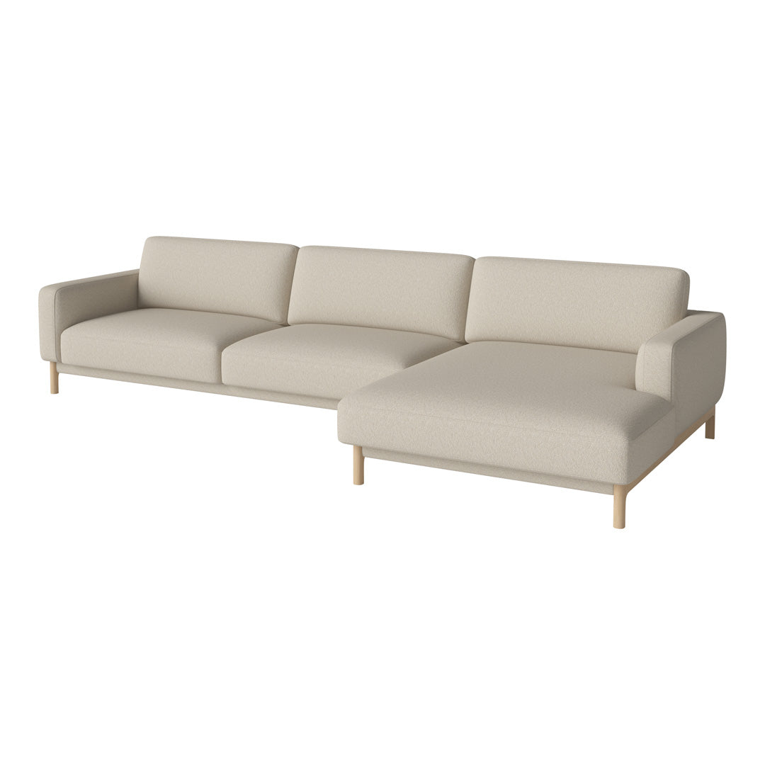 Light beige sectional sofa with minimalist design and subtle texture, complemented by wooden legs. Perfect for modern decor.