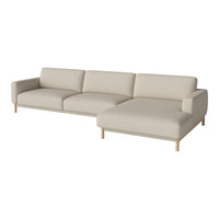 Light beige sectional sofa with minimalist design and subtle texture, complemented by wooden legs. Perfect for modern decor.