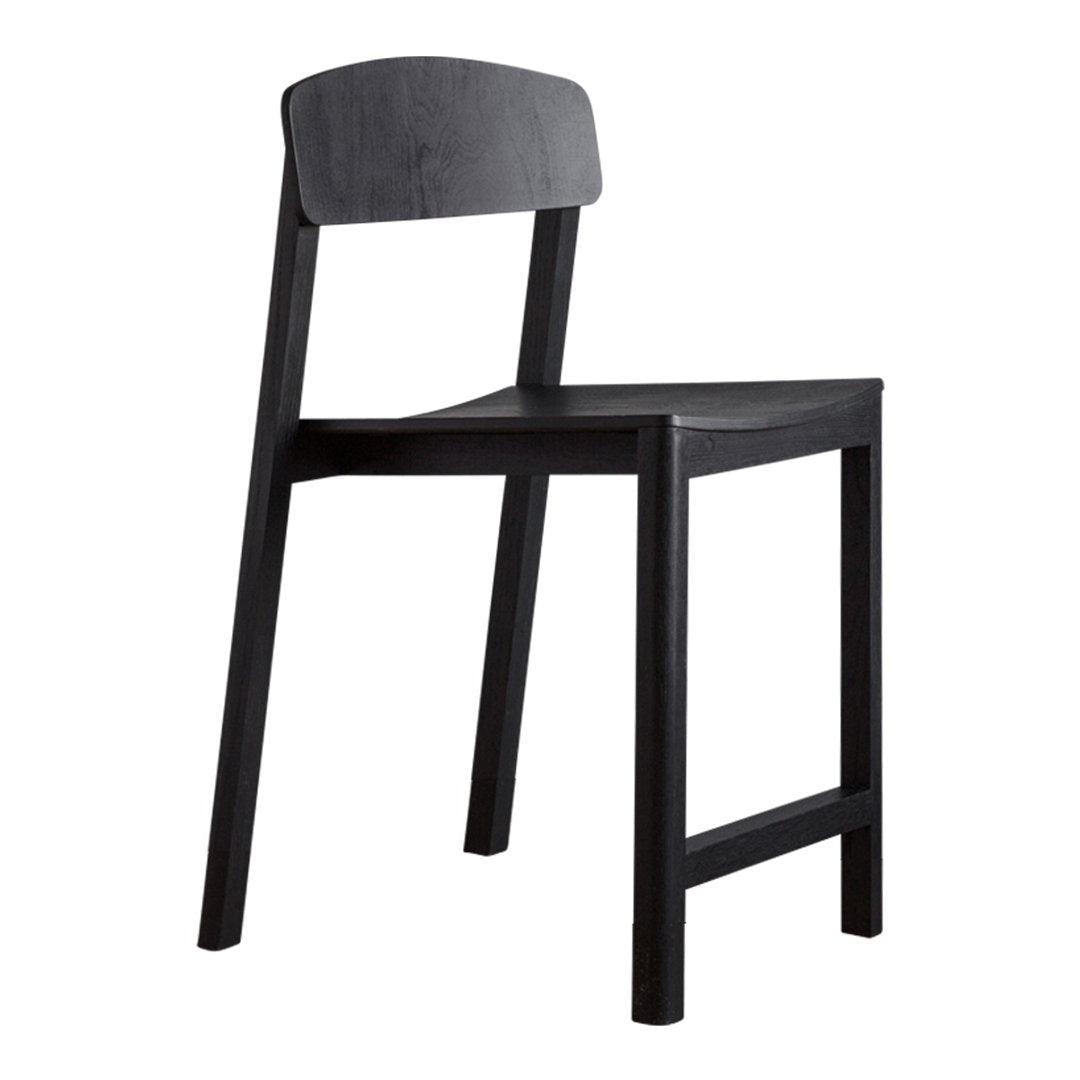 Sleek black dining chair with a smooth finish and minimalist design, perfect for modern decor.