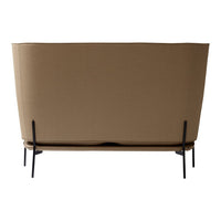 "Cozy beige sofa with plush cushions and a sleek black metal frame, featuring a minimalist design for modern decor."