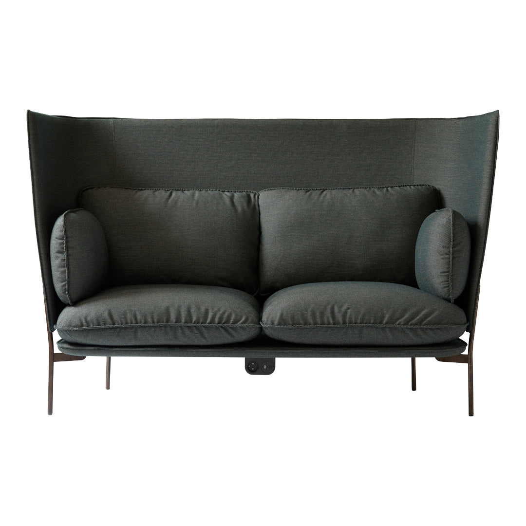 Dark green upholstered sofa with soft cushions and a modern, sleek design featuring a high back.