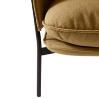 Stylish mustard yellow cushion with a smooth texture, paired with sleek black metal legs.