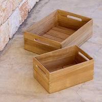 Natural wooden storage boxes in a warm, light brown finish with a simple slatted pattern. Perfect for organizing.