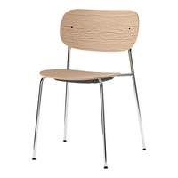 Light wood chair with a natural finish and sleek chrome legs, showcasing a minimalist design and smooth surface.