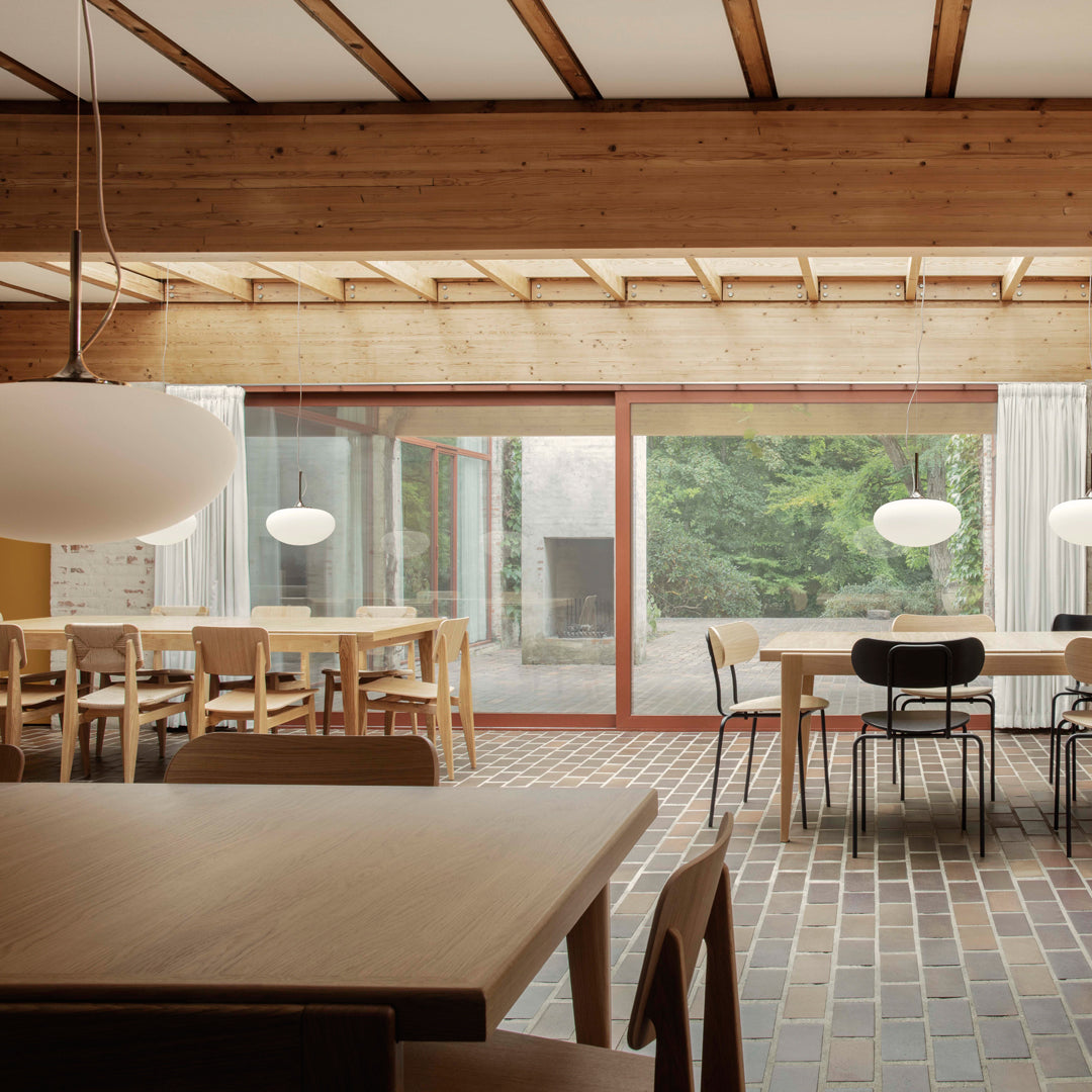Wooden tones with white lighting and earthy brick patterns, creating a warm, inviting interior atmosphere.