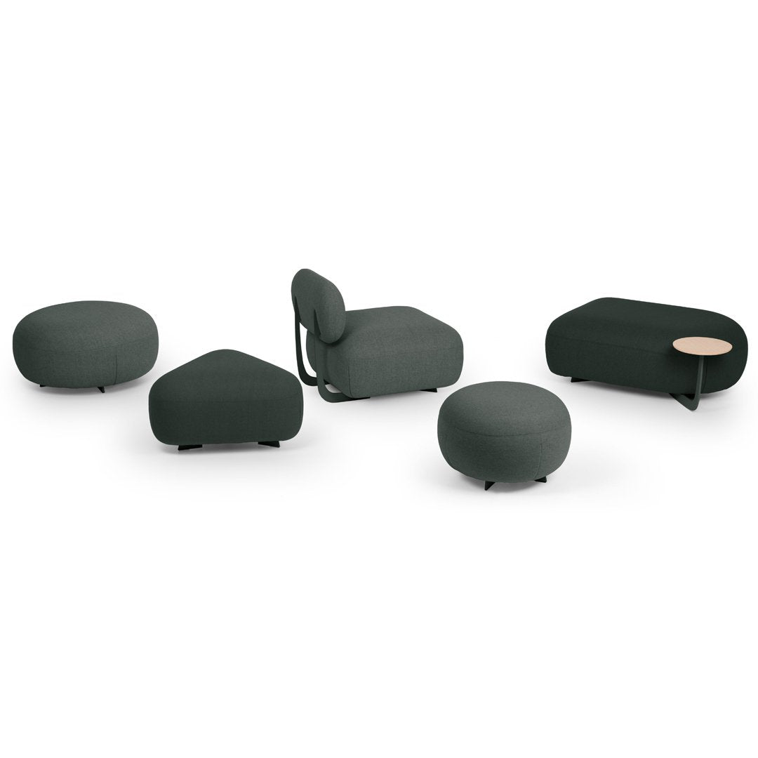 Set of modern furniture in dark green upholstery with various organic shapes and textures, including a side table.