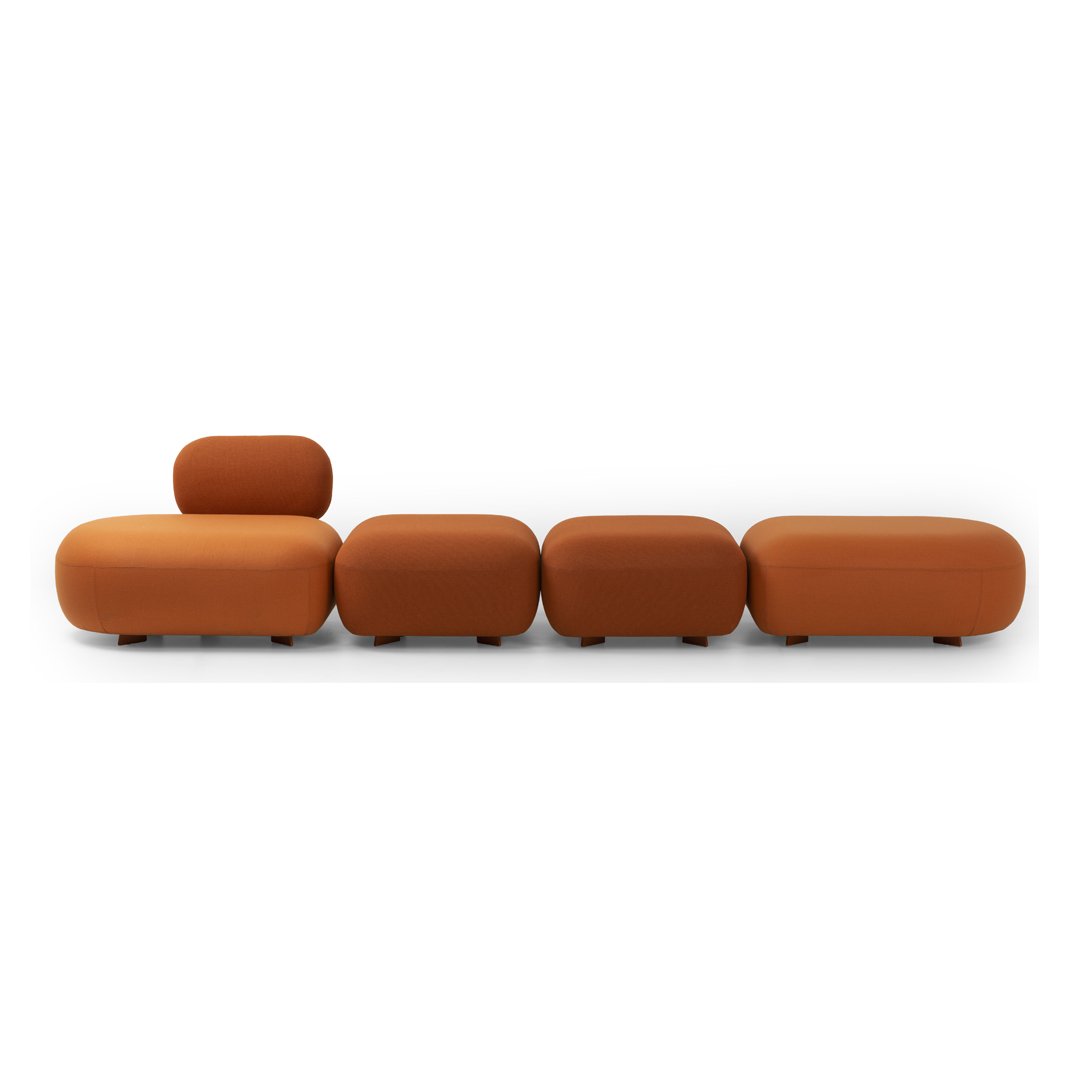 Contemporary modular sofa in warm shades of terracotta and deep orange, featuring smooth, rounded shapes.