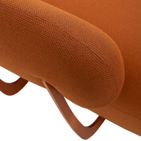 Textured orange fabric upholstery with a rounded armrest and sleek metal accents in a modern design.